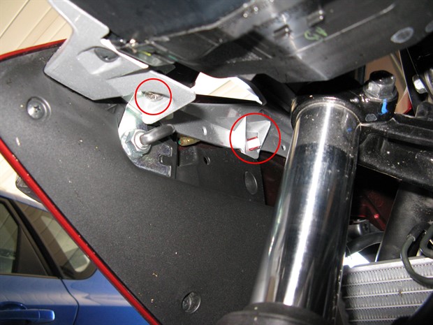 Location of inside top mounting bolt for middle fairing panel as well as tab