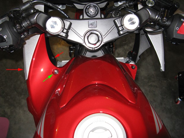 Location of bolt and clips securing fuel tank side cover
