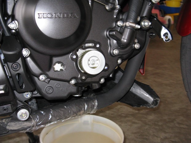 Oil filter cover removed, 2012 Honda CBR250RA