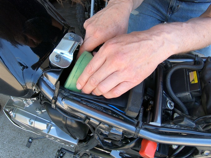 DR200SE - inserting the clean and oiled air filter into the air box
