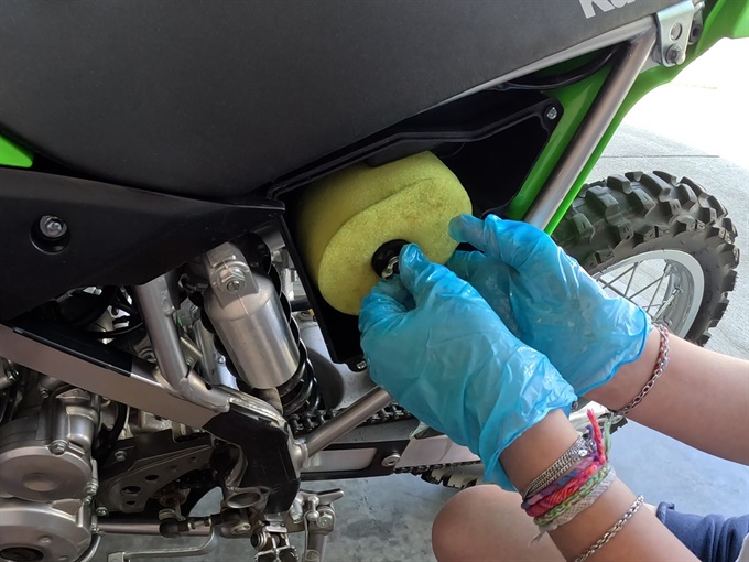 KLX140L - inserting the clean and oiled air filter into the air box