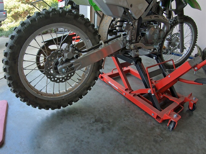 KLX140L on jack with rear wheel off the ground