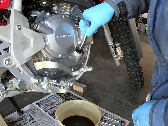 Loosening the oil filler cap/dipstick with a Motion Pro timing plug wrench - CRF250F