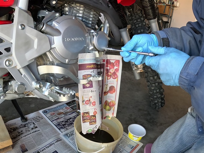 Removing oil filter cover bolts - CRF250F
