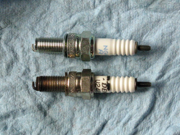 Comparing a new spark plug to a used one