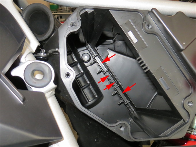 CRF300L with air filter removed. Positioning points indicated.