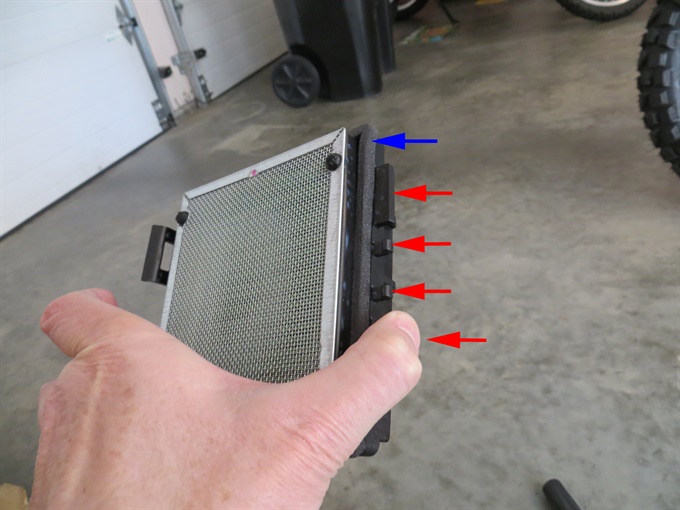 CRF300L air filter with side facing engine. Red arrows = rear alignment tabs (one hidden). Blue arrow = foam gasket.