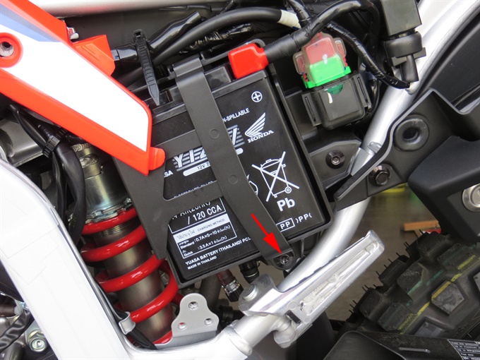 CRF300L battery and battery holder bolt (shroud in place)