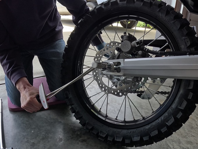 Using a torque wrench to tighten up the rear axle nut to spec - CRF300L