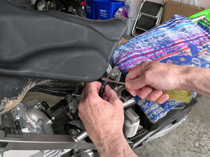 Disconnecting fuel line at fuel tank (petcock) - KLX140