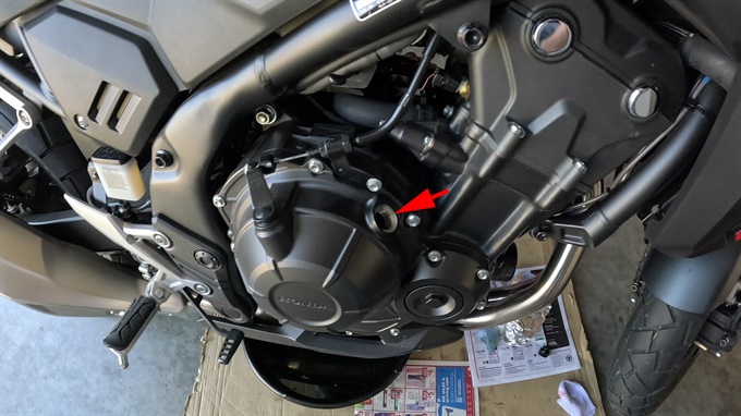 The oil filler hole with cap removed, 2024 Honda NX500