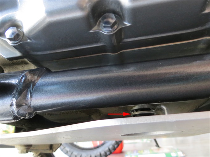 Loosened oil drain plug with sealing washer