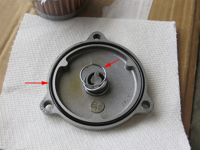 Oil filter cover with O-ring and spring installed - DR650SE