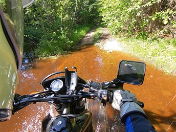 Crossing flooded trail on DR650SE, N of Aberdeen Lake.